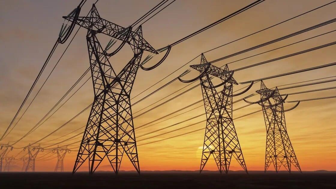 Iraq city and electrical infrastructure at sunset